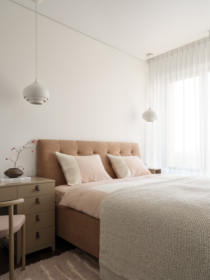 Beige bed in the bedroom