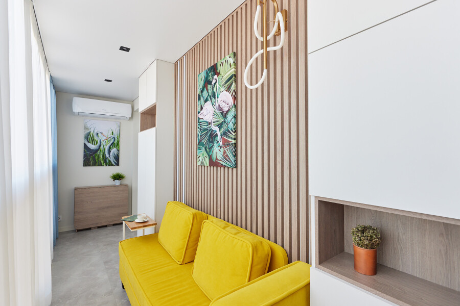 Yellow sofa on the balcony